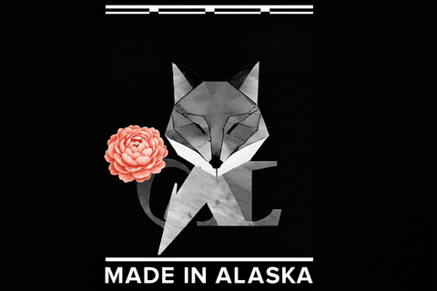 Geometric fox design with a flower and 'Made in Alaska' text on a black background