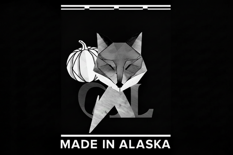 Grey Fox Candles geometric fox logo with a white pumpkin and Made in Alaska text on a black background.