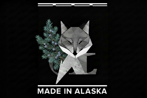 Geometric fox design with foliage and 'Made in Alaska' text on a black background