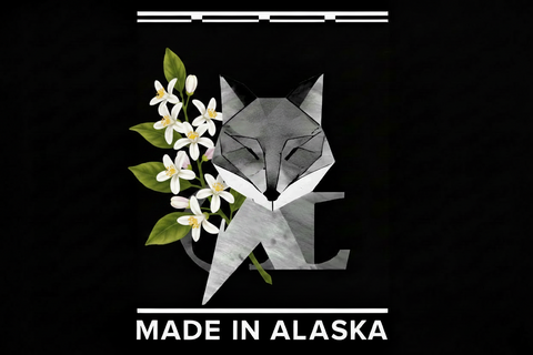Geometric fox design with lemon blossom flowers and 'Made in Alaska' text on a black background