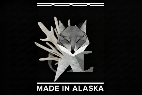 Geometric fox logo with antlers on a black background, featuring 'Made in Alaska'.