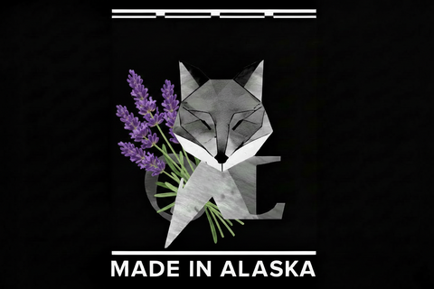 Geometric fox holding lavender with 'Made in Alaska' text on a black background