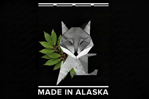 Geometric fox design with leaves and 'Made in Alaska' text on a black background