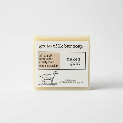 A clean product graphic for goat's milk bar soap labeled 'naked goat' on a white background. The design includes the text 'goat's milk bar soap,' a beige callout box with 'all natural,' 'farm fresh,' 'cruelty free,' and 'made in alaska,' a black goat illustration, and 'UNSCENTED'
