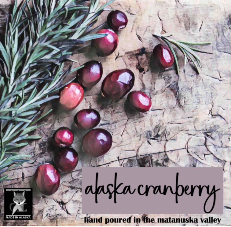 Alaska cranberries with spruce sprig on a textured surface, featuring the 'Made in Alaska' logo.