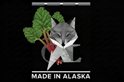 Geometric fox design with rhubarb leaves and stems on a black background, featuring 'Made in Alaska' text.
