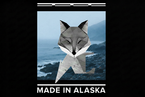 Grey Fox Candles geometric fox logo with misty Alaska coastline and 'Made in Alaska' text on black background