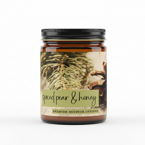 Beeswax lotion packaging with spiced pear & honey text, featuring a pine cone and leaves.
