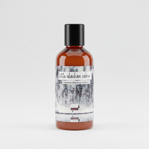 trial size of Little Alaskan Cabin premium beeswax lotion on a light gray background, made by grey fox candles, made in alaska