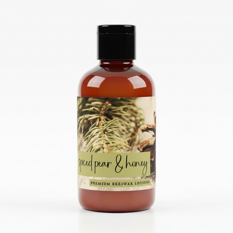 Beeswax lotion packaging with spiced pear & honey text, featuring a pine cone and leaves.
