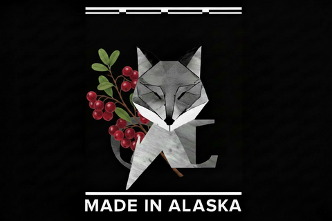 Geometric fox design with cranberries and 'Made in Alaska' text on a black background