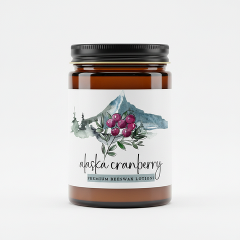 Alaska Cranberry premium beeswax lotion jar with mountain and cranberry design on label.