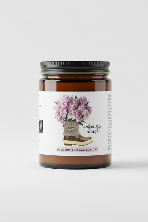 Premium beeswax lotions. The label central illustration of pink PEONIES in a rustic woven basket on a stack of books, flanked by text detailing the handcrafted ingredients (almond oil, avocado, olive oil).