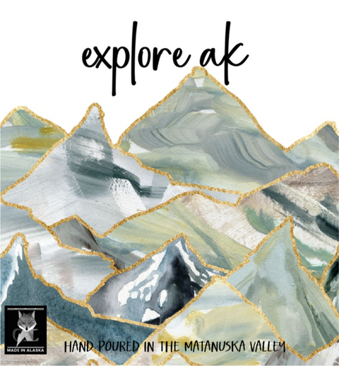 Product packaging with mountain design and 'explore ak' text, featuring a brand logo.