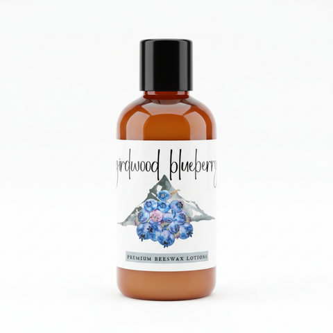 Girdwood Blueberry premium beeswax lotion trial size bottle with blueberries and text.