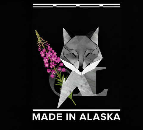 Geometric fox design with pink fireweed flowers and 'Made in Alaska' text on a black background