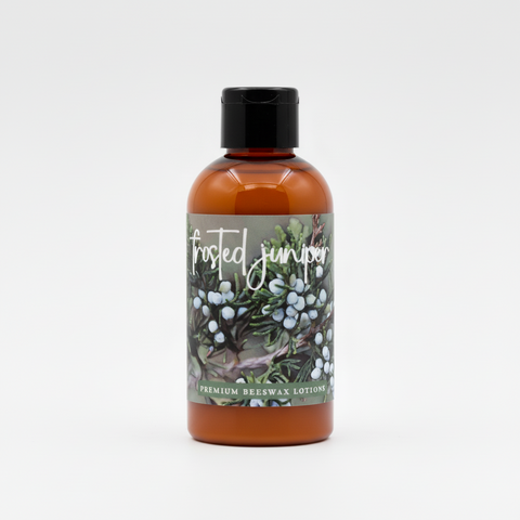 Frosted Juniper product packaging with wintery design and branding details.