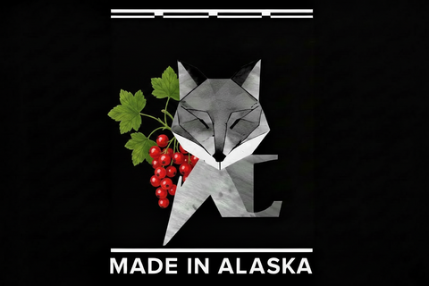 Geometric fox design with red berries and green leaves on a black background with 'Made in Alaska' text.