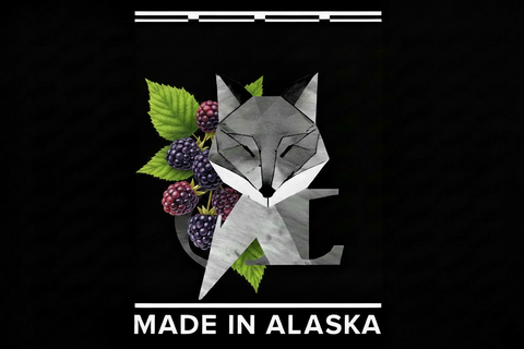 Geometric fox design with berries and leaves on a black background with 'Made in Alaska' text.