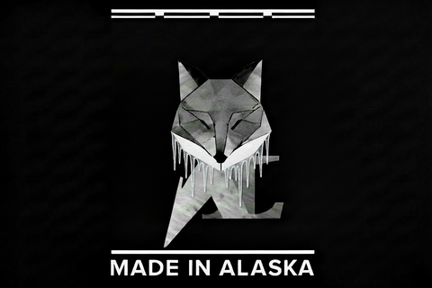 Geometric fox design with a frosty grey fox a 'Made in Alaska' text on a black background
