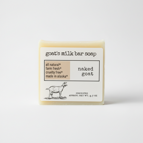 A clean product graphic for goat's milk bar soap labeled 'naked goat' on a white background. The design includes the text 'goat's milk bar soap,' a beige callout box with 'all natural,' 'farm fresh,' 'cruelty free,' and 'made in alaska,' a black goat illustration, and 'UNSCENTED'