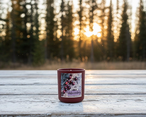 alaska cranberry candle, coconut wax candle, made in alaska, alaska made, USA made, old farmhouse table with candle on it, spruce trees in the evening background