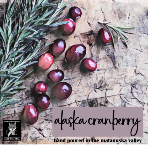 Alaska cranberries with spruce sprig on a textured surface, featuring the 'Made in Alaska' logo.