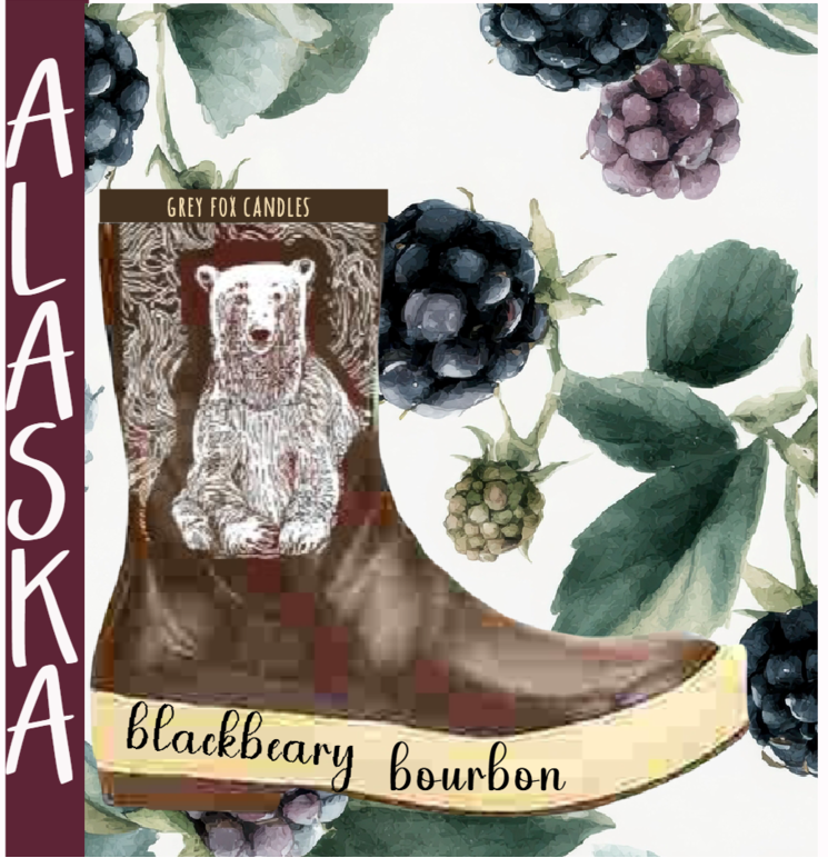 Candle labeled 'Blackbeary Bourbon' with a bear illustration on a boot, surrounded by berries and leaves.