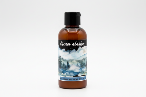 Dream Alaska premium body lotion packaging with mountain and forest design.
