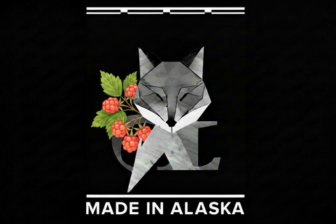 Geometric fox design with berries and 'Made in Alaska' text on a black background