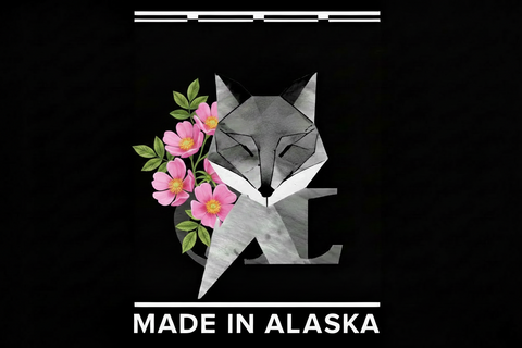 Geometric fox design with pink flowers and 'Made in Alaska' text on a black background