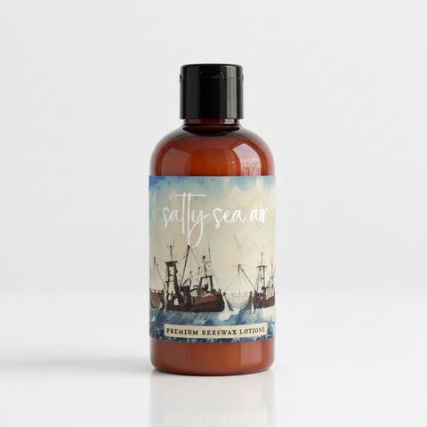 Advertisement for 'Salty Sea Air' premium beeswax lotions with ship illustration and product description.