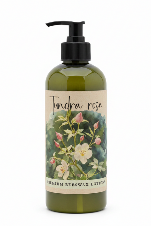 A product information card for Tundra Rose Premium Beeswax Lotions. The card features a central floral illustration of a yellow and white flower with pink buds on a green and blue watercolor background.