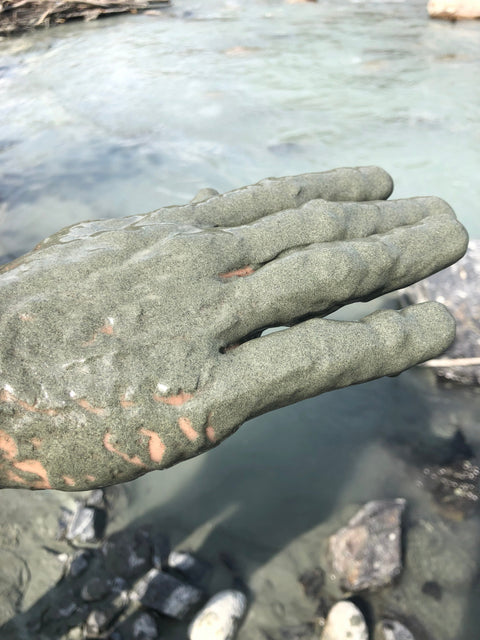 raw glacier silt shown on hand obtained directly from the exclusive Alaska stream